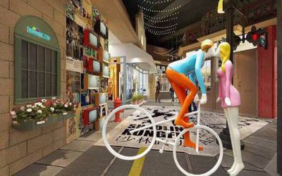 街道玻璃鋼彩繪男子騎車親吻的愛情雕塑